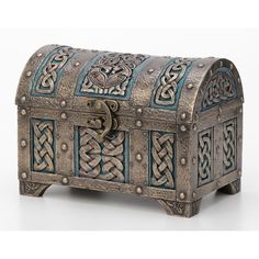 an old metal chest with intricate designs on it