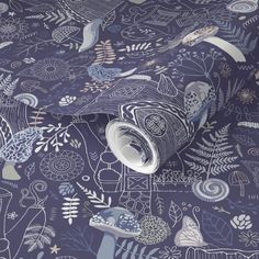 a wallpaper with blue and white designs on it's surface, including leaves