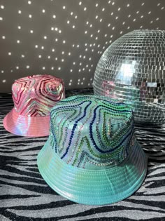 Metallic bucket hats in either baby blue or baby pink and embellished with rhinestones Summer festival season never looked so sparkly One Size FREE UK DELIVERY Trendy Party Mini Hats, Summer Festival High Crown Hats, Summer Hats With Rhinestones And Short Brim, Trendy Rhinestone Hats For Spring, Diy Festival Accessories, Fun Short Brim Party Hat, Adjustable Summer Hats With Bling, Adjustable Mini Hats For Summer Carnival, Fun Party Hat With Short Brim