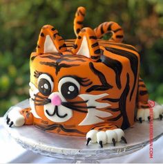 a close up of a cake decorated to look like a tiger