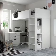 a white loft bed sitting next to a desk