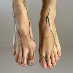 a person with tattoos on their legs and feet