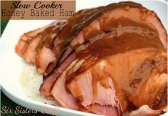 slow cooker honey baked ham on top of rice in a white bowl with caramel sauce