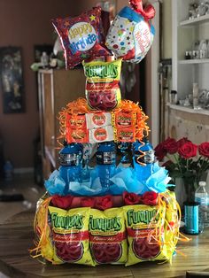 a cake made out of candy and balloons