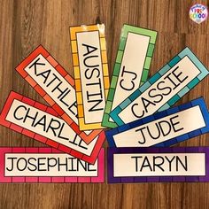 four colorful name tags with the names of each child's name and their corresponding colors