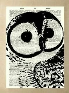 an owl with big eyes sitting on top of a book page