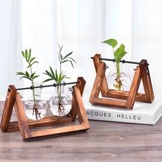 two wooden planters with plants in them