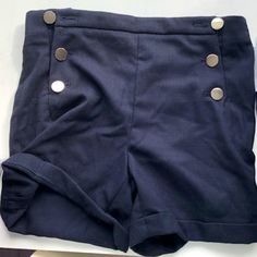 Never Worn. High-Waisted Navy Blue Shorts. 6 Button Nautical-Style. Nice Fabric, Good For Dress Attire. Fitted Blue Bottoms With Buttons, Classic Blue Bottoms With Buttons, Preppy Fitted High-waist Bottoms, Preppy Fitted High Waist Bottoms, Preppy High Waist Fitted Bottoms, Preppy High-waisted Fitted Bottoms, Blue Bottoms With Buttons For Workwear, Navy Bottoms With Buttons For Work, Classic Summer Bottoms With Buttons