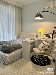 a bed room with a neatly made bed and a chair next to a desk in front of a window