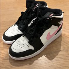 Black And White Air Jordan Sneakers With Pink Nike Swoosh And Pink Soles. Good Condition, Worn Less Than 5 Times. Size 5.5y/7w Pink And Black Nikes, Air Jordan 1 Mid Gs, Nike Air Jordan 1 Mid, Air Jordan Sneakers, Pink Nike, Jordan Sneakers, Pink Nikes, Nike Air Jordan 1, Nike Swoosh