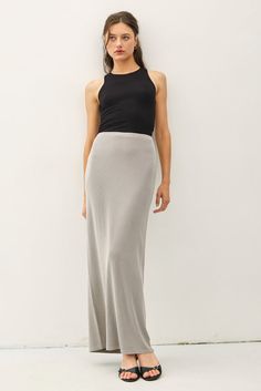 Indulge in luxury with the Be Cool Jersey Knit Maxi Long Pencil Skirt. This ladies skirt features a high rise and a fitted silhouette for a sophisticated look. The ribbed knit fabric and elastic waistband provide comfort while maintaining a lightweight and stretchy feel. Perfect for any casual occasion. Elegant Ribbed Skirt For Workwear, Elegant Ribbed Skirt For Work, Elegant Ribbed Maxi Skirt, Elegant Ribbed Bottoms, Elegant Ribbed Skirt, Elegant Fitted Bottoms With Ribbed Waistband, Elegant Ribbed Stretch Bottoms, Chic Ribbed Maxi Skirt For Spring, Long Relaxed Ribbed Skirt