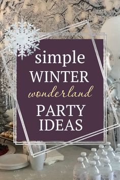 a table topped with bottles and glasses filled with drinks next to a sign that says, simple winter wonderland party ideas