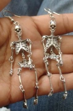 Measurements: 90mm/3.5in Crafted with attention to detail, each earring features a delicate skeletal design, perfect for adding a touch of macabre elegance to any outfit. Made from light weight materials, these earrings are comfortable to wear all day or night. Whether you're dressing up for Halloween or simply embracing your inner gothic style, these skeleton earrings are sure to turn heads and spark conversation. Upgrade your accessory game with these hauntingly beautiful earrings today! Skeleton Earrings, Dangly Earrings, Gothic Fashion, Skeleton, Beautiful Earrings, Jewelry Box, Jewelry Earrings Dangle, Etsy Earrings, Dangle Drop Earrings