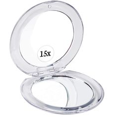 an empty compact mirror with the lid open