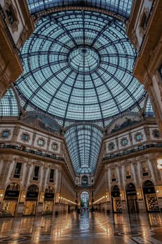 the inside of a large building with glass ceiling