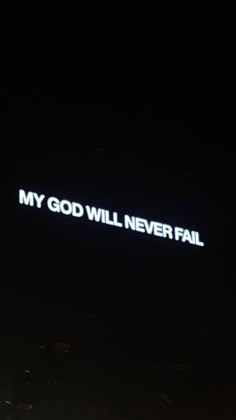 the words my god will never fail are lit up in the dark