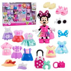 the minnie mouse doll is in its box and has many accessories including shoes, purses,