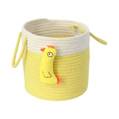 a yellow and white basket with a chicken on it