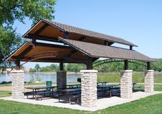 an outdoor picnic area with tables and benches