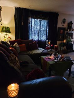 a living room filled with lots of furniture next to a fire place in front of a window