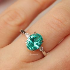 Gorgeous Paraiba Tourmaline Ring ►Made of solid sterling silver with rhodium finish (925) ►Accented With Simulated Diamonds (CZ) ►Average band width: 2 mm Center Stone: Paraiba Tourmaline Color: Turquoise Shape: Oval Measurements: 7.0 x 9.0 mm Carat Weight: 1.8 ct. (approx.) Gemstone creation: lab-grown Hardness: 7-7.5 (Mohs scale) ✓ 100% Nickel-Free ✓ Hypoallergenic ✓ Comfort Fit ✓ Free Ring Box ✓ Free USA Shipping Neon Turquoise, Paraiba Tourmaline Ring, Engagement Ring On Hand, Dream Rings, Set Rings, Ring Inspo, Silver Engagement Ring, Mohs Scale, Engagement Ring For Women