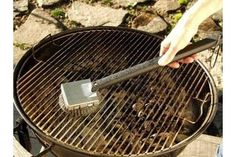 someone is grilling something with a spatula in their hand