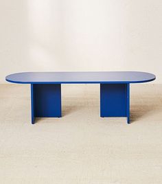 a blue table sitting on top of a white floor