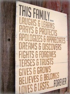 this family laughs and learns prays & proclaims signs are hung on the fence