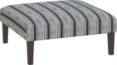 an upholstered footstool with blue and white striped fabric on it's legs