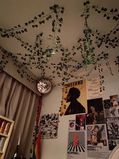 the ceiling is covered with vines and posters