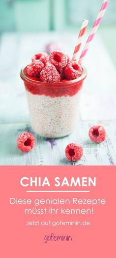 a bowl filled with raspberries next to a pink and white striped straw