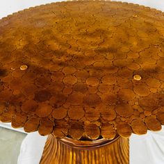 a wooden table topped with lots of brown circles on it's top and bottom