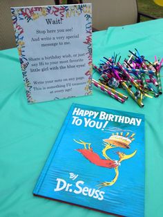 the dr seuss birthday card is next to some crayons