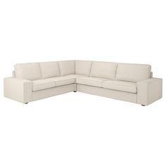 a white sectional couch sitting on top of a white floor