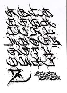 some type of calligraphy written in black ink