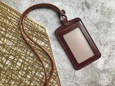 Everyday Rectangular Leather Luggage Tag, Brown Leather Luggage Tag With Patch, Luxury Leather Luggage Tag With Sleeve, Rectangular Leather Luggage Tag With Patch, Leather Brown Luggage Tag With Sleeve