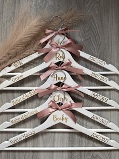 wedding dress hangers with names and ribbons