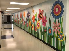 an empty hallway painted with flowers and grass