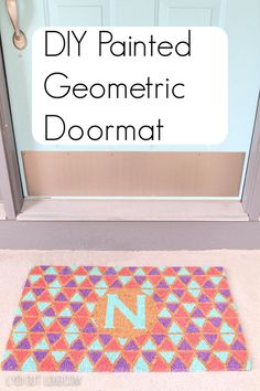 a door mat that has the letter n painted on it and is in front of a door