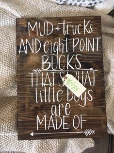 a wooden sign that says mud trucks and eight point bucks that's little boys are made of