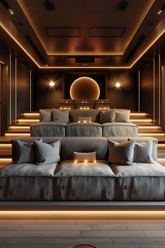 a large couch sitting in the middle of a room filled with lots of pillows and lights