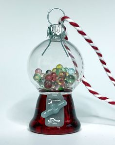 a glass ornament filled with lots of candy