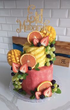 a birthday cake with fruit on top