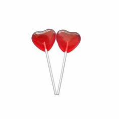 two heart shaped lollipops sitting on top of each other