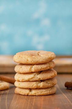 a stack of cookies sitting on top of a wooden table