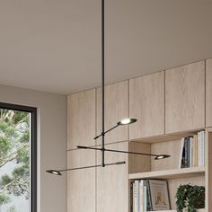 a modern kitchen with wooden cabinets and white counter tops, along with an open window to the outside