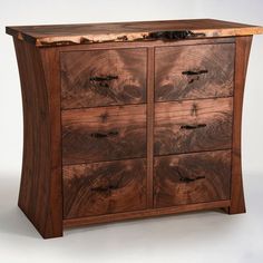 a large wooden dresser with drawers on it