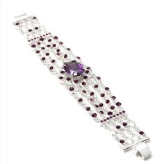 The Cz oval strand bracelet is so charming! This contemporary design is made up of Cz encrusted oval shaped stone, making this piece gleam in the light. This bracelet measures approximately 7" x 1" and 32.3 in weight. It's perfect for proms, bridesmaids, dance party or any special occasion! Cheap Polished Oval Beaded Bracelets, Elegant Amethyst Crystal Bracelet, Elegant Purple Crystal Bracelet, Oval Jeweled Crystal Jewelry, Elegant Oval Jeweled Bracelets, Elegant Oval Jeweled Bracelet, Elegant Adjustable Oval Crystal Bracelet, Bridesmaids Dance, Amethyst Flower