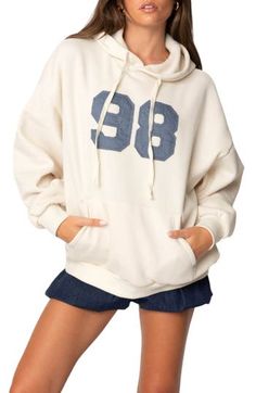 Make it your year in this soft slouchy hoodie designed in a baggy fit and framed by dropped shoulders. Drawstring hood Ribbed cuffs and hem Kangaroo pocket 50% cotton, 50% polyester Machine wash, dry flat Imported Wwe T Shirts, Flannel Sweatshirt, Hoodie Oversize, Girls Blouse, Oversized Hoodie, Guess Jeans, Oversize Hoodie, Baggy Fits, Hoodie Design