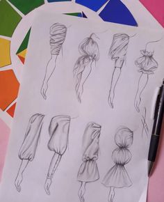 a drawing of different hair styles on top of a piece of paper with a pen